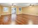 Large living room with hardwood floors and ceiling fans at 9715 Taylor Rose Ln # 9715, Seminole, FL 33777