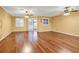 Spacious living area with hardwood floors and plantation shutters at 9715 Taylor Rose Ln # 9715, Seminole, FL 33777