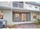 Back exterior view of the house with screened porch at 9715 Taylor Rose Ln # 9715, Seminole, FL 33777