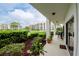 White patio with potted plants and view of neighboring building at 102 Mariner Dr, Tarpon Springs, FL 34689