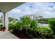 Lush green landscape and pond view from the patio at 102 Mariner Dr, Tarpon Springs, FL 34689