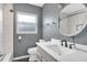 Modern bathroom with gray walls and a white vanity at 11320 114Th Ave, Largo, FL 33778