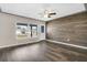 Spacious living room featuring wood-look floors and a statement wall at 11320 114Th Ave, Largo, FL 33778