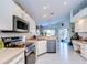 Well-equipped kitchen featuring stainless steel appliances and ample counter space at 11511 Lounds Ct, New Port Richey, FL 34654