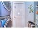 Laundry room with washer, dryer, and extra storage at 11511 Lounds Ct, New Port Richey, FL 34654