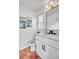 Compact bathroom with a white vanity, marble countertop, and a simple, clean design with traditional tile flooring at 11624 Monette Rd, Riverview, FL 33569