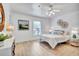 Cozy bedroom with ceiling fan, natural light, and comfortable furnishings for a relaxing retreat at 11624 Monette Rd, Riverview, FL 33569