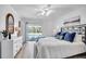 Bedroom showcasing large bed, dresser, and an outside view of the pool area for relaxation at 11624 Monette Rd, Riverview, FL 33569