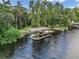 Wooden dock extending over calm river water at 11624 Monette Rd, Riverview, FL 33569