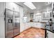 Modern kitchen with stainless steel appliances and terracotta tile floors at 11624 Monette Rd, Riverview, FL 33569