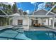 Inviting pool area with covered patio, spa, and outdoor dining space at 11624 Monette Rd, Riverview, FL 33569