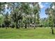 Scenic riverfront view with lush vegetation and gazebo at 11624 Monette Rd, Riverview, FL 33569