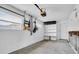 Garage with built-in shelving and a new garage door opener at 117 73Rd Ave, St Pete Beach, FL 33706