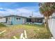 House exterior view, teal colored with a screened porch at 117 73Rd Ave, St Pete Beach, FL 33706