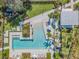 Luxury resort-style pool with surrounding landscaping at 12292 Lyon Pine Ln, Odessa, FL 33556