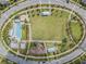 Aerial view of community green space and pool at 12292 Lyon Pine Ln, Odessa, FL 33556