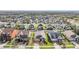 Aerial view of a community with many houses and green spaces at 12292 Lyon Pine Ln, Odessa, FL 33556