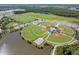 Multiple baseball fields surrounded by a lake at 12292 Lyon Pine Ln, Odessa, FL 33556