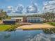 Modern clubhouse with water views and sandy beach at 12292 Lyon Pine Ln, Odessa, FL 33556