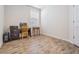 Home office with wood-look flooring and a desk at 12292 Lyon Pine Ln, Odessa, FL 33556