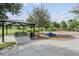 Covered picnic area and playground with play equipment at 12292 Lyon Pine Ln, Odessa, FL 33556