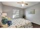 Bedroom with queen bed, ceiling fan, and coastal decor at 1400 Gandy N Blvd # 1407, St Petersburg, FL 33702