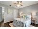 Bright bedroom with queen bed, ceiling fan, and wood floors at 1400 Gandy N Blvd # 1407, St Petersburg, FL 33702