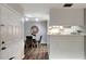 Small dining area with white table and gray chairs, near kitchen at 1400 Gandy N Blvd # 1407, St Petersburg, FL 33702