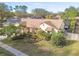 Aerial view of single story house with beautifully landscaped yard at 14031 Shady Shores Dr, Tampa, FL 33613