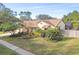 Aerial view of single story house with well-manicured lawn at 14031 Shady Shores Dr, Tampa, FL 33613