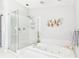 Spa-like bathroom with a large soaking tub and glass shower at 14031 Shady Shores Dr, Tampa, FL 33613