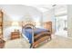 Spacious bedroom with wooden furniture and ensuite bathroom access at 14031 Shady Shores Dr, Tampa, FL 33613