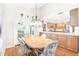 Dining area with wood table and chairs, adjacent to kitchen at 14031 Shady Shores Dr, Tampa, FL 33613