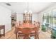 Spacious dining room featuring a large wood table and ample natural light at 14031 Shady Shores Dr, Tampa, FL 33613