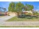 Single-story house with a well-manicured lawn and attached garage at 14031 Shady Shores Dr, Tampa, FL 33613