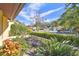 Relaxing front patio with seating area and lush landscaping at 14031 Shady Shores Dr, Tampa, FL 33613