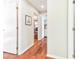 Bright hallway with hardwood floors and access to other rooms at 14031 Shady Shores Dr, Tampa, FL 33613