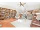 Living room with built-in bookshelves and tile floors at 14031 Shady Shores Dr, Tampa, FL 33613