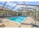 Beautiful screened pool with plenty of space for relaxation and entertainment at 14031 Shady Shores Dr, Tampa, FL 33613