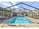 Expansive screened pool and patio, ideal for relaxation and gatherings at 14031 Shady Shores Dr, Tampa, FL 33613