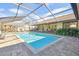 Refreshing screened pool and patio with ample space for lounging at 14031 Shady Shores Dr, Tampa, FL 33613