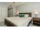 King-size bed in a well-lit bedroom with wood furniture at 145 2Nd S Ave # 616, St Petersburg, FL 33701