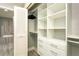 Walk-in closet with built-in shelving and drawers for optimal organization at 145 2Nd S Ave # 616, St Petersburg, FL 33701