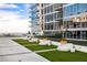 Relaxing rooftop deck with artificial turf and lounge chairs at 145 2Nd S Ave # 616, St Petersburg, FL 33701