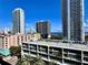 A vibrant city view showcases modern architecture, featuring a rooftop and surrounding high-rise buildings on a clear, sunny day at 145 2Nd S Ave # 616, St Petersburg, FL 33701