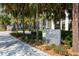 Well-manicured landscaping and elegant signage at the building entrance, surrounded by lush greenery at 145 2Nd S Ave # 616, St Petersburg, FL 33701