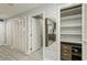 Bright hallway with white louvered doors and wood-look floors at 145 2Nd S Ave # 616, St Petersburg, FL 33701