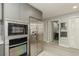 Modern kitchen with stainless steel appliances, sleek cabinetry, and an adjacent doorway leading to other rooms at 145 2Nd S Ave # 616, St Petersburg, FL 33701