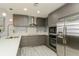 Modern kitchen with stainless steel appliances and breakfast bar at 145 2Nd S Ave # 616, St Petersburg, FL 33701