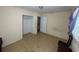 Simple bedroom with tile floors and a closet at 14810 N 30Th St, Lutz, FL 33559